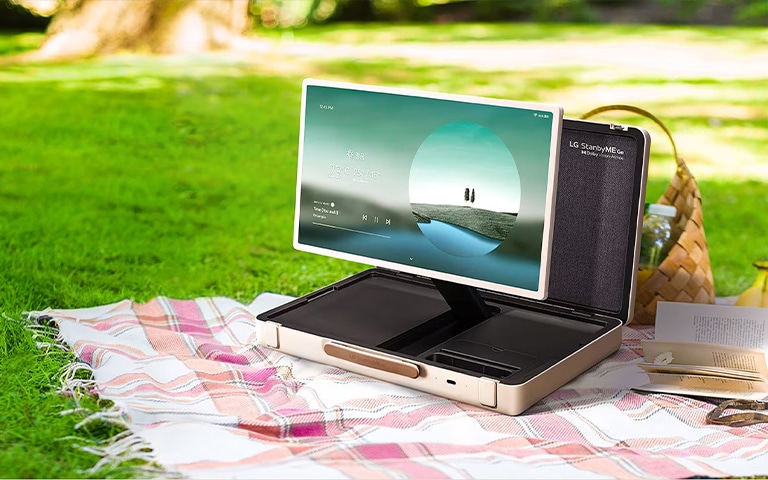 LG stanbyme go in a outdoor, picnic setting