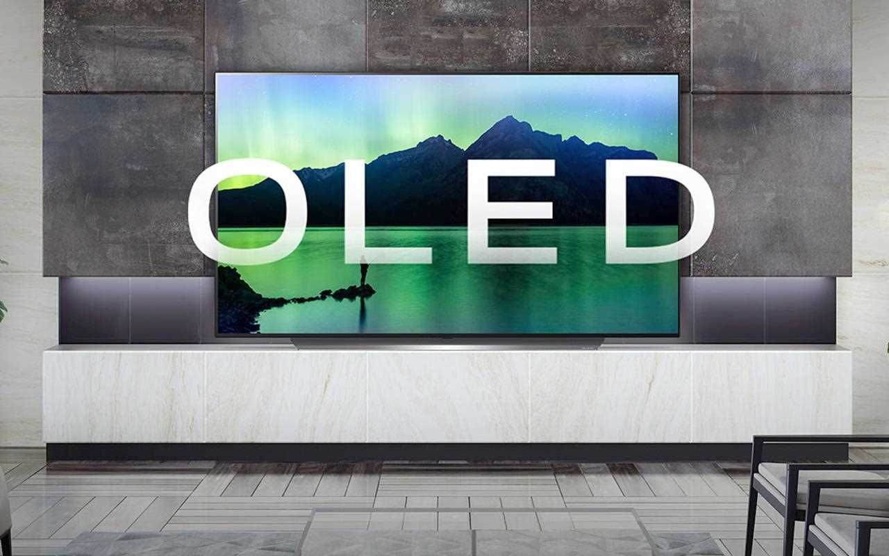 An LG OLED TV with a landscape in-screen image.